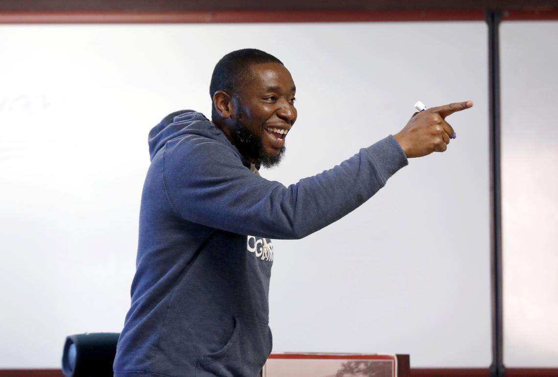 Patrick Douthit, better know as 9th Wonder, laughs as he talks with students while teaching the History of Hip Hop at North Carolina Central University in Durham, N.C., Thursday, October 24, 2019.