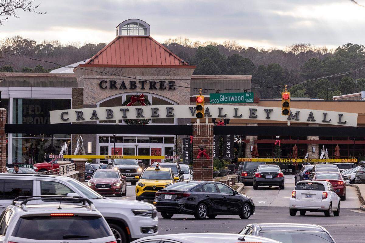 Holiday shoppers drive through the entrance of Crabtree Valley Mall on Glenwood Avenue in Raleigh Monday, Dec 12, 2022. The mall has been for sale on the market for nearly a year.