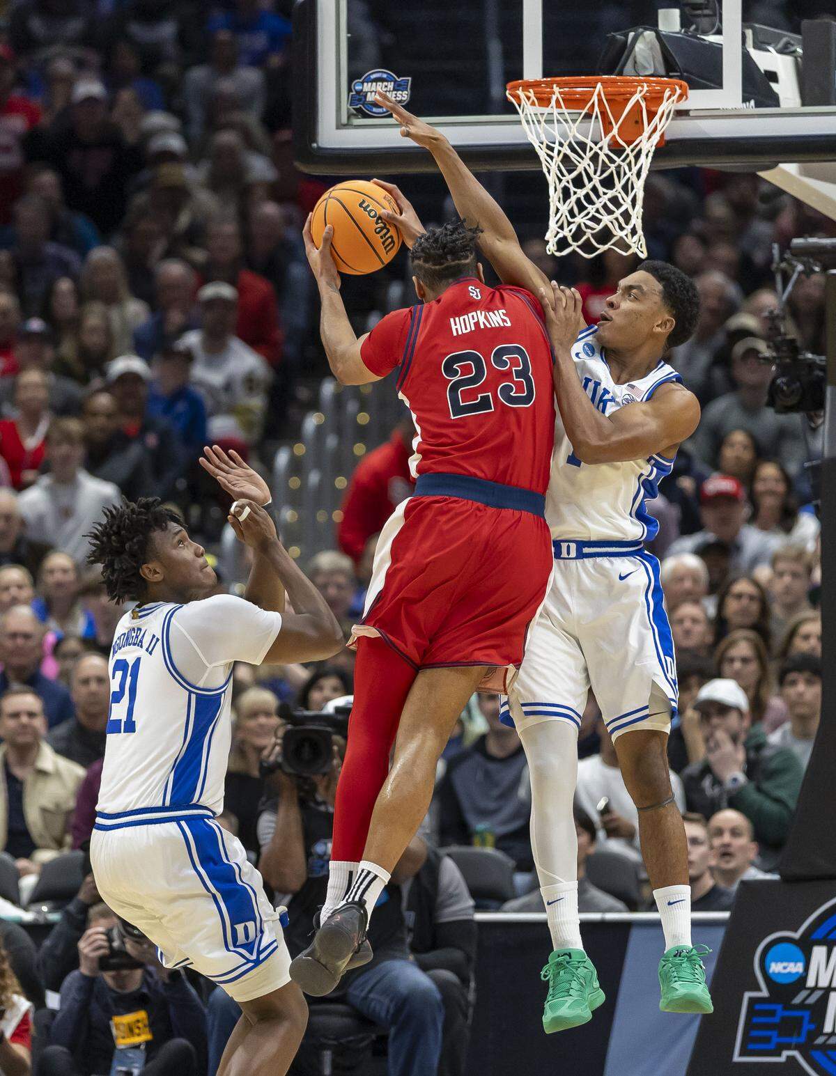 Duke guard Caleb Foster (1) defends St. John’s Bryce Hopkins (23) in the first half on Friday, March 27, 2026, during the Sweet Sixteen of the NCAA Tournament at Capital One Arena in Washington, D.C.