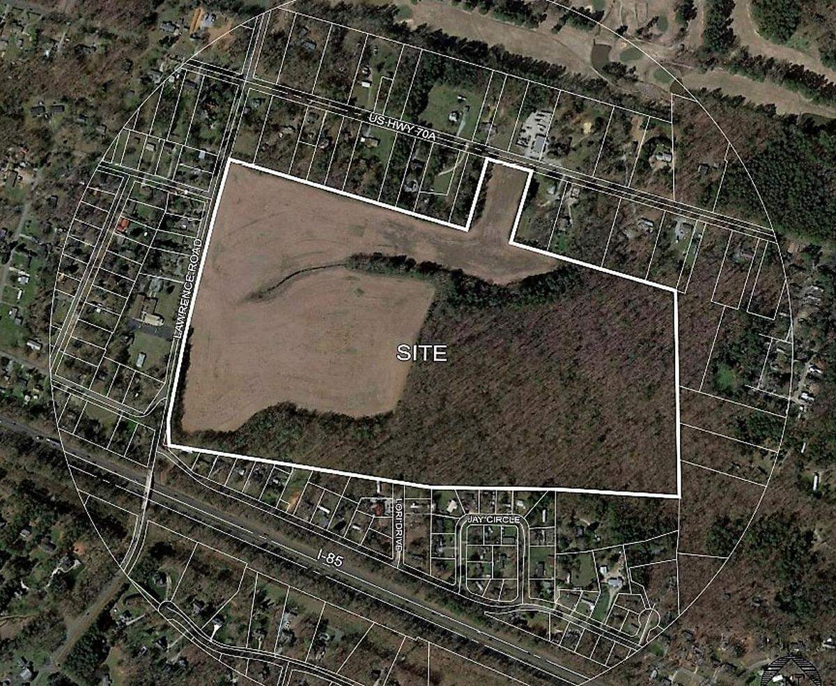 Two charter schools and multiple athletic facilities are proposed for an 85-acre, undeveloped site on Lawrence Road between U.S. 70A and Old N.C. 10 just east of the Hillsborough town limits.
