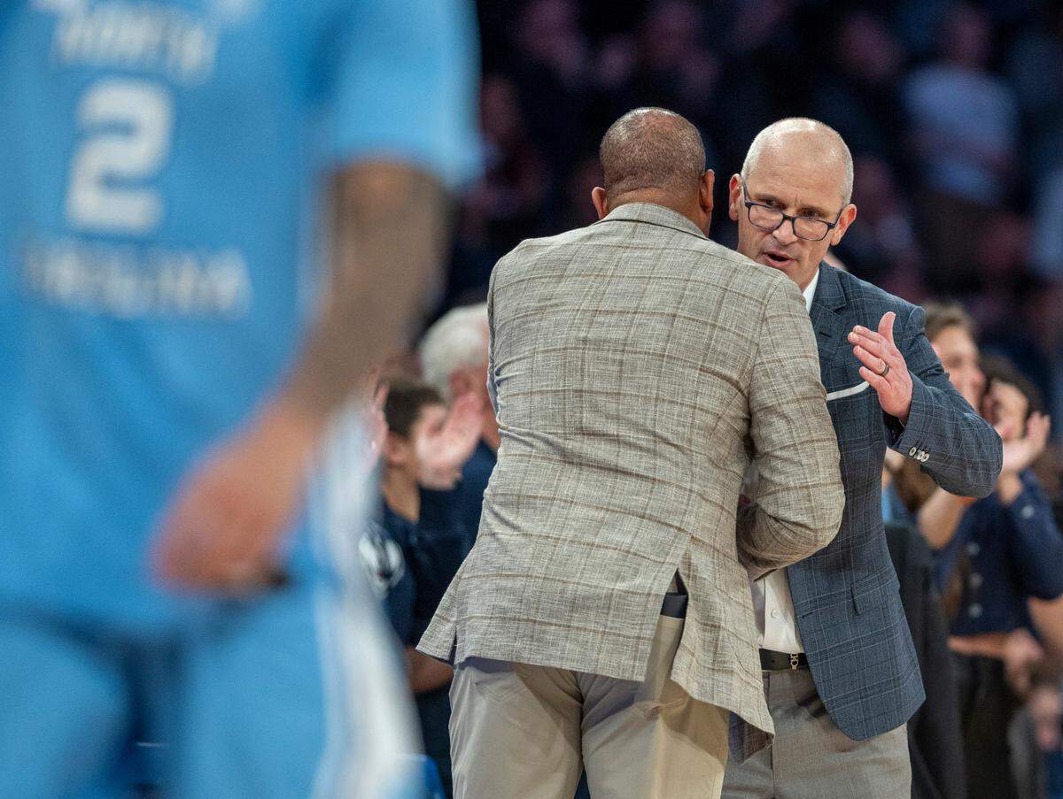 University of Connecticut head coach Dan Hurley congratulates North Carolina coach Hubert Davis following the Huskies’ 87-76 victory in the Jimmy V Classic on Tuesday, December 5, 2023 at Madison Square Garden in New York, NY.