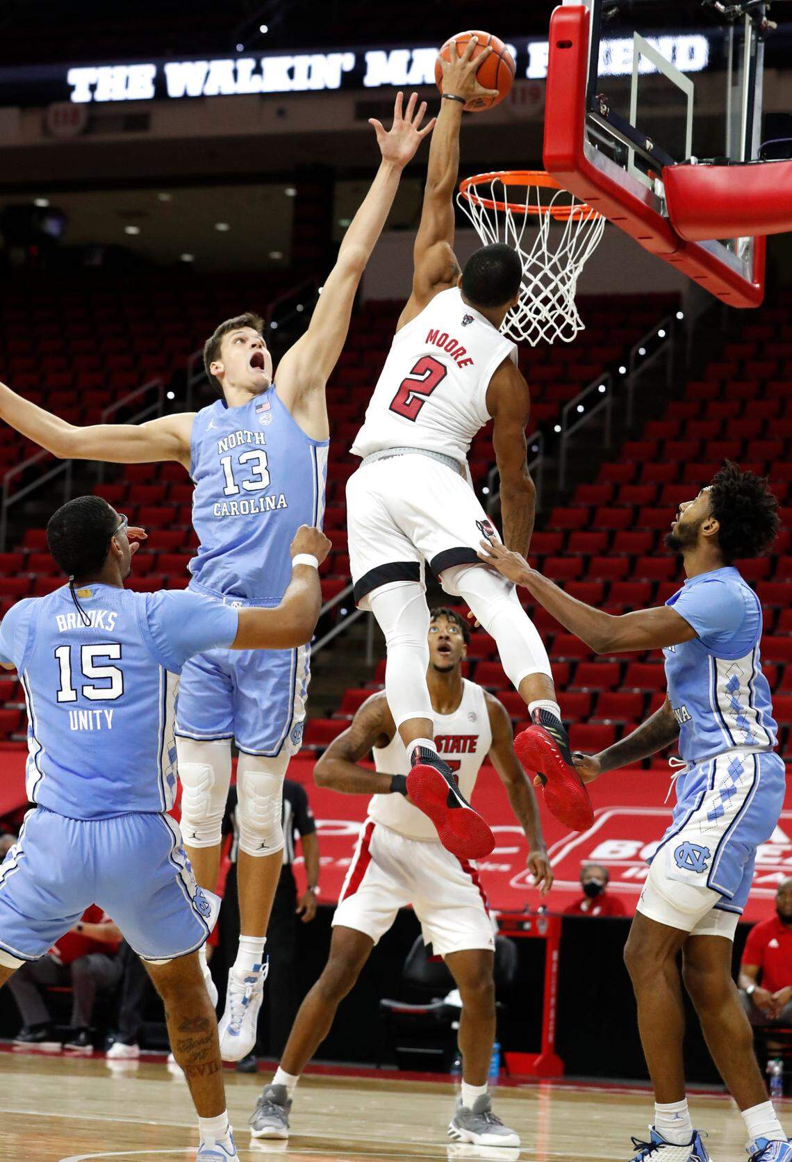N.C. State’s Shakeel Moore (2) prepares to slam in two during the second half of N.C. State’s 79-76 victory over UNC at PNC Arena in Raleigh, N.C., Tuesday, December 22, 2020.