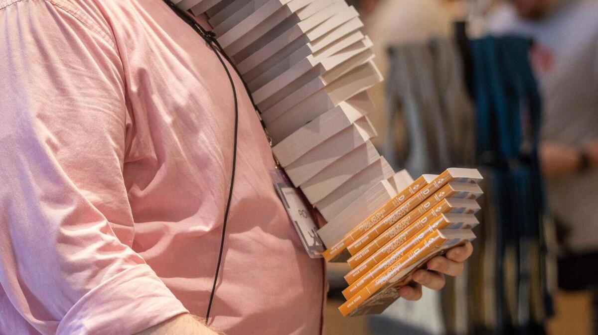 Barnes & Noble employee Ron Sehl stocks the shelves at the new Barnes & Noble store which opened in the Shoppes of Kildare at 1311 Kildaire Farm Road on Wednesday, July 5, 2023 in Cary, N.C