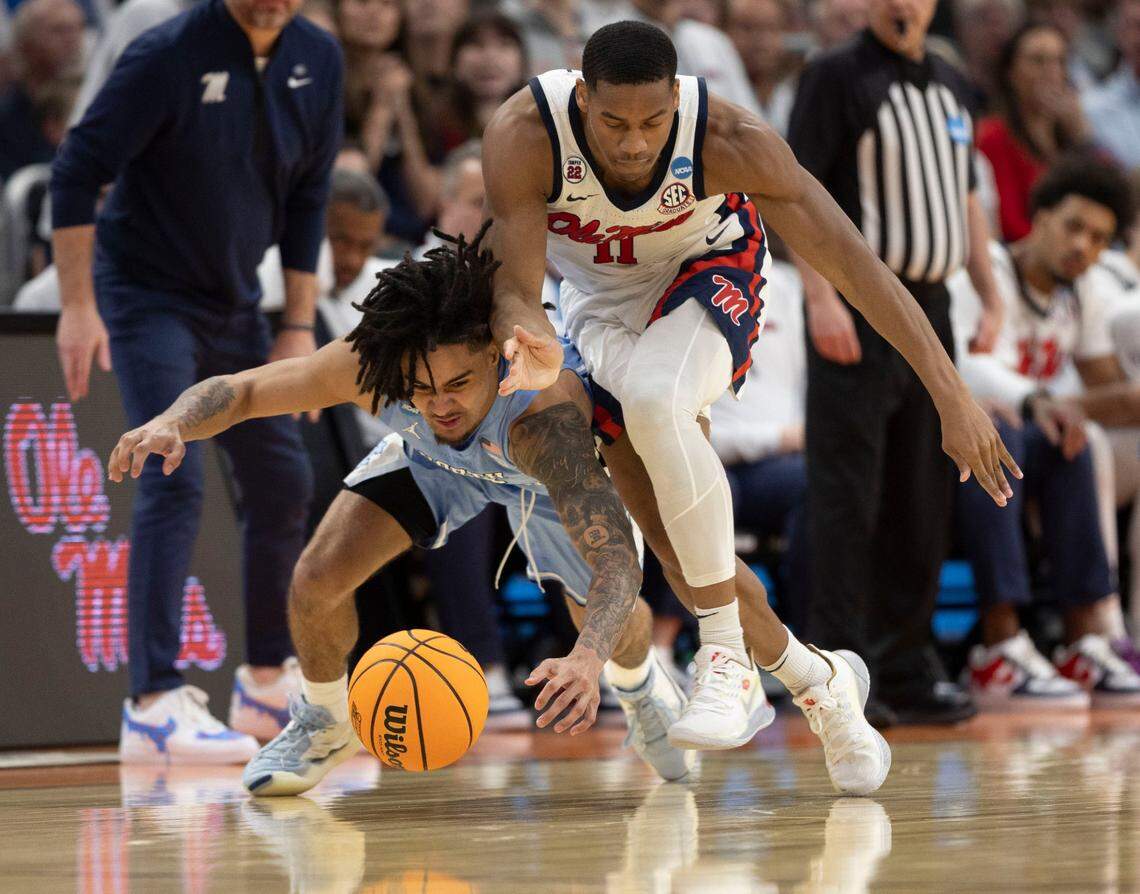 North Carolina guard Elliot Cadeau (3) makes a steal from Ole Miss’ Matthew Murrell (11) in the second half in the first round of the NCAA Tournament on Friday, March 21, 2025 at Fiserv Forum in Milwaukee, Wisconsin.