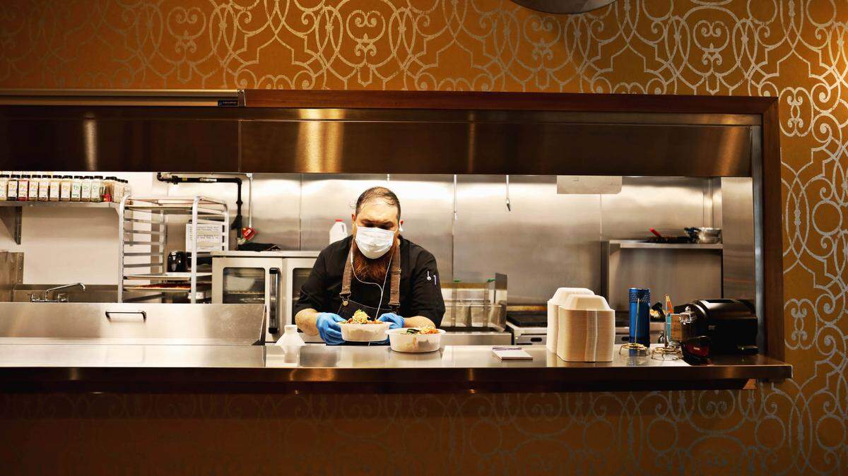 Chef RJ St. John works in the kitchen at The Nomad in downtown Hillsborough on Wednesday, Aug. 19, 2020. The restaurant opened during the pandemic and has adjusted the menu to offer take-out to accommodate customers.