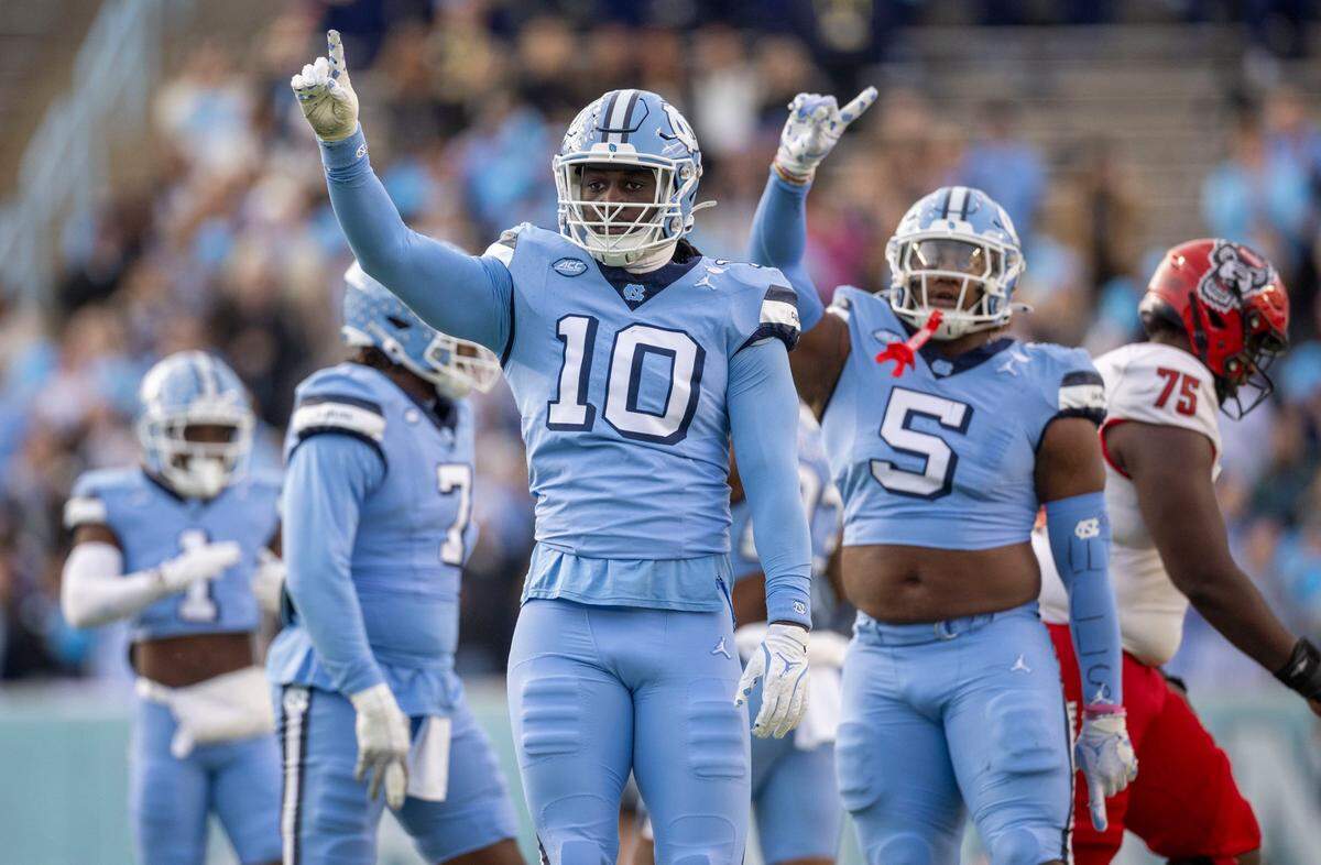 North Carolina defensive lineman Desmond Evans (10) reacts after a sack of N.C. State quarterback C.J. Bailey (16) in the first quarter on Saturday, November 30, 2024 at Kenan Stadium in Chapel Hill, N.C.
