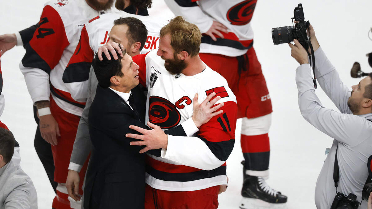 Carolina Hurricanes coach Rod Brind’Amour and captain Jordan Staal embrace on the ice after the Canes defeated Vegas to win the Stanley Cup.