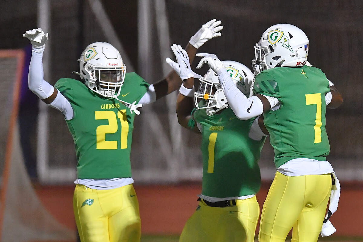 Cardinal Gibbons’ Xavier Hasan (21) celebrates his interception and touchdown against Hillside with teammates during the first half. The Cardinal Gibbons Crusaders and the Durham Hillside Hornets met in the third round of the NCHSAA 4A playoffs in Raleigh, N.C. on November 29, 2024.