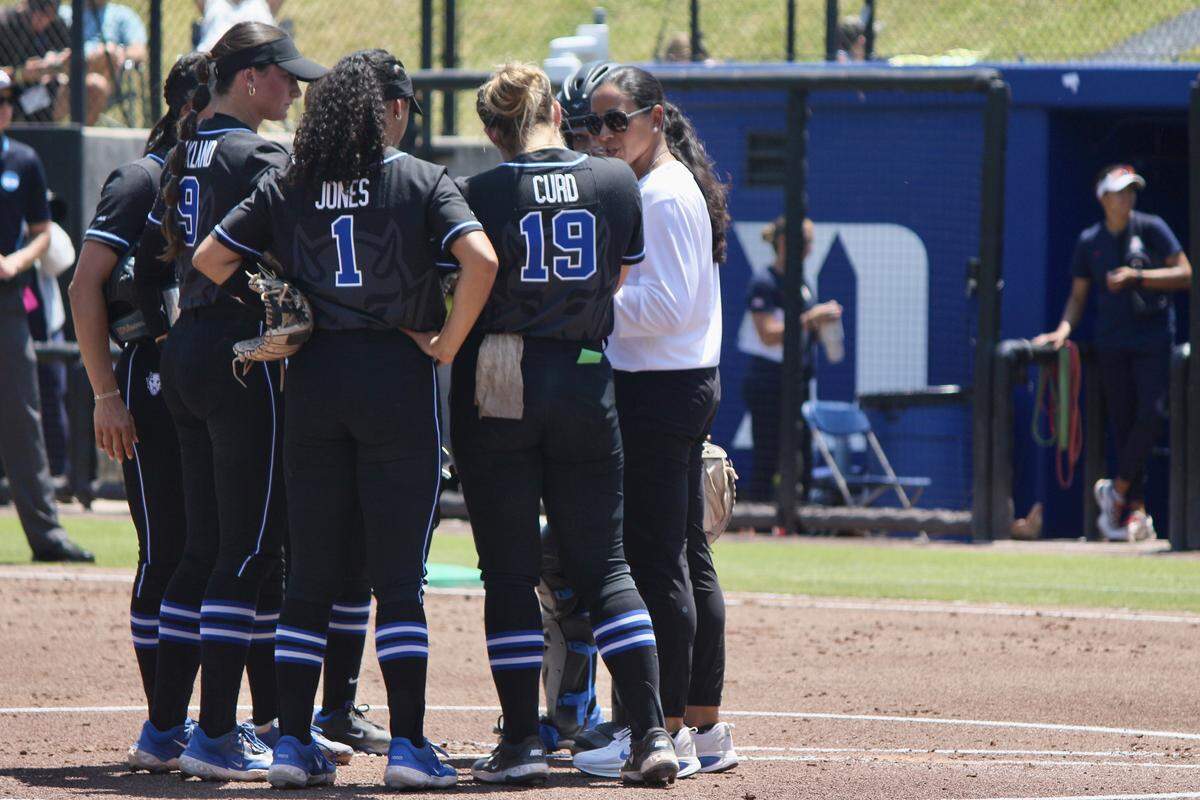 Duke head coach Marissa Young meets with the infield during the Blue Devils’ NCAA Tournament regional game against Arizona at Smith Family Stadium in Durham, North Carolina, on May 16, 2026.