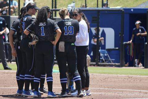 Duke head coach Marissa Young meets with the infield during the Blue Devils’ NCAA Tournament regional game against Arizona at Smith Family Stadium in Durham, North Carolina, on May 16, 2026.