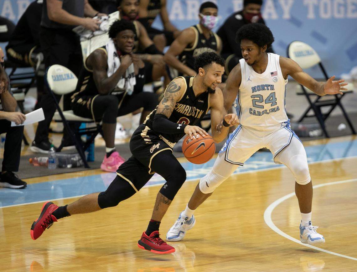 College of Charleston’s Payton Willis (0) drives to the basket against North Carolina’s Kerwin Walton (24) during the second half on Wednesday, November 25, 2020 at the Smith Center in Chapel Hill, N.C.