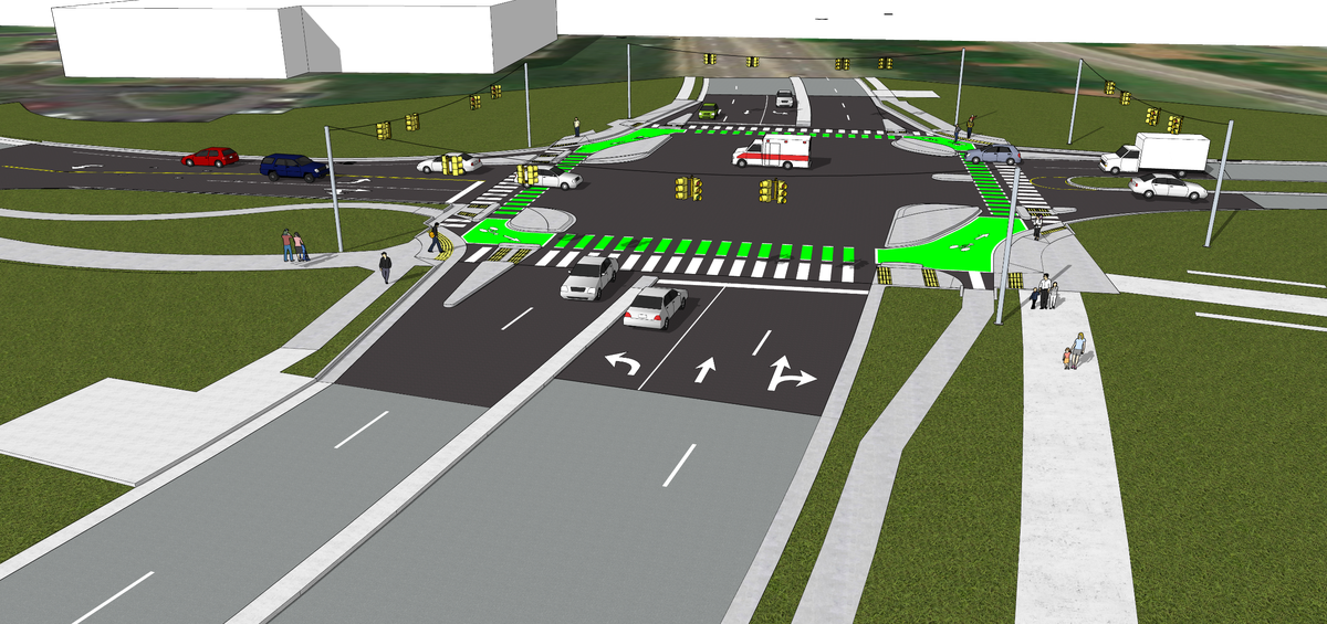 The City of Raleigh is creating a “protected intersection” where Blue Ridge Road, center, meets Reedy Creek Road, left, and the N.C. Museum of Art entrance, right. The islands on the corners help protect cyclists and pedestrians and force cars making right turns to go slower than they do now.