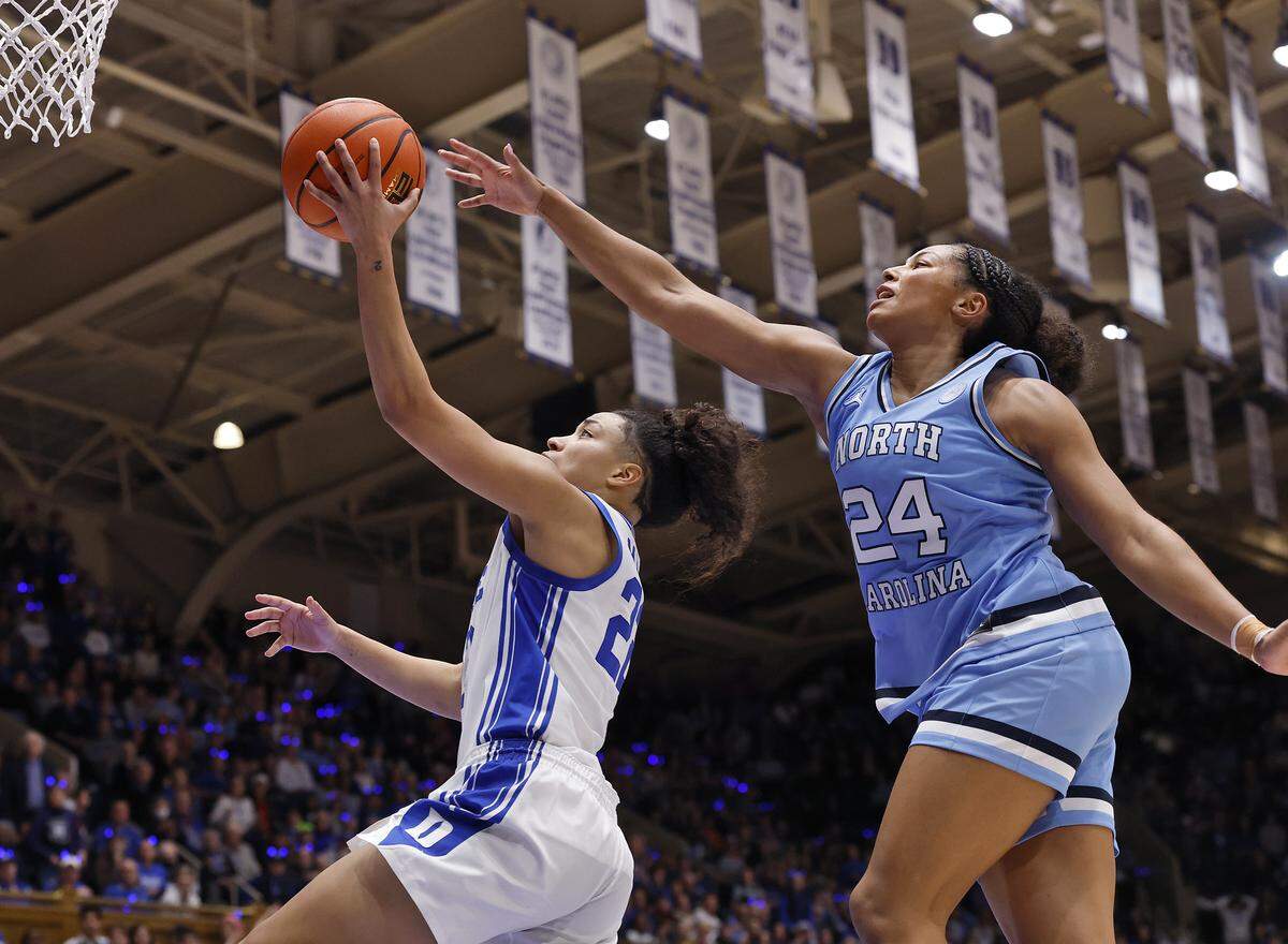Duke’s Taina Mair drives to the basket past North Carolina’s Indya Nivar during the second half of the Blue Devils’ 72-68 win on Sunday, Feb. 15, 2026, at Cameron Indoor Stadium in Durham, N.C.