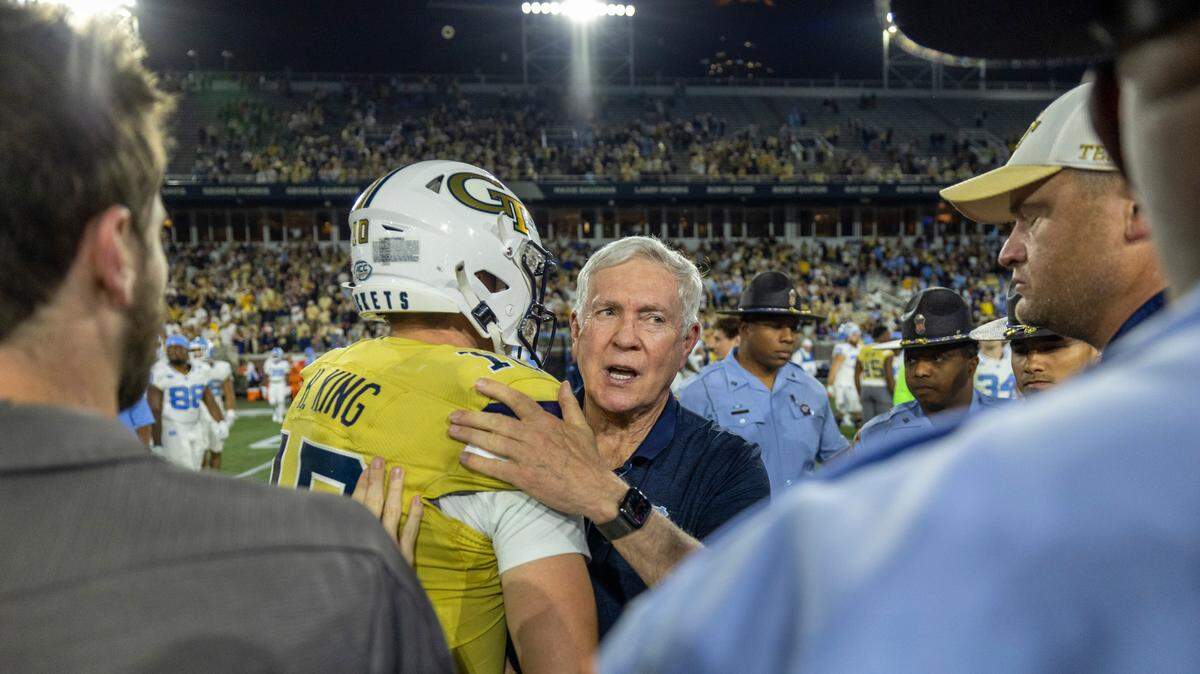 North Carolina coach Mack Brown congratulates Georgia Tech quarterback Haynes King (10) following the Yellow Jackets’ 46-42 victory on Saturday, October 28, 2023 at Bobby Dodd Stadium in Atlanta, Georgia.