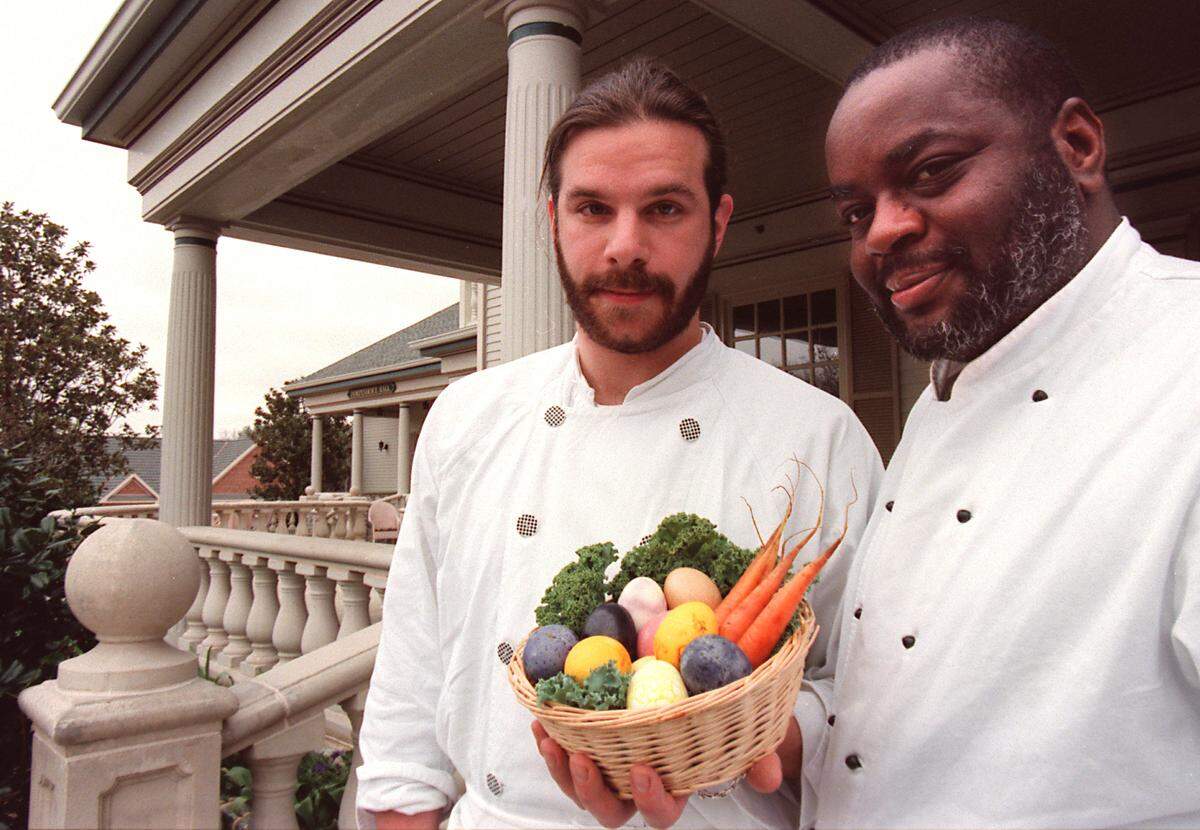 Sam Poley, sous chef, at left, and Walter Royal, then head chef at The Inn at Bonnie Brae, hold a basket of Easter eggs in 1996.