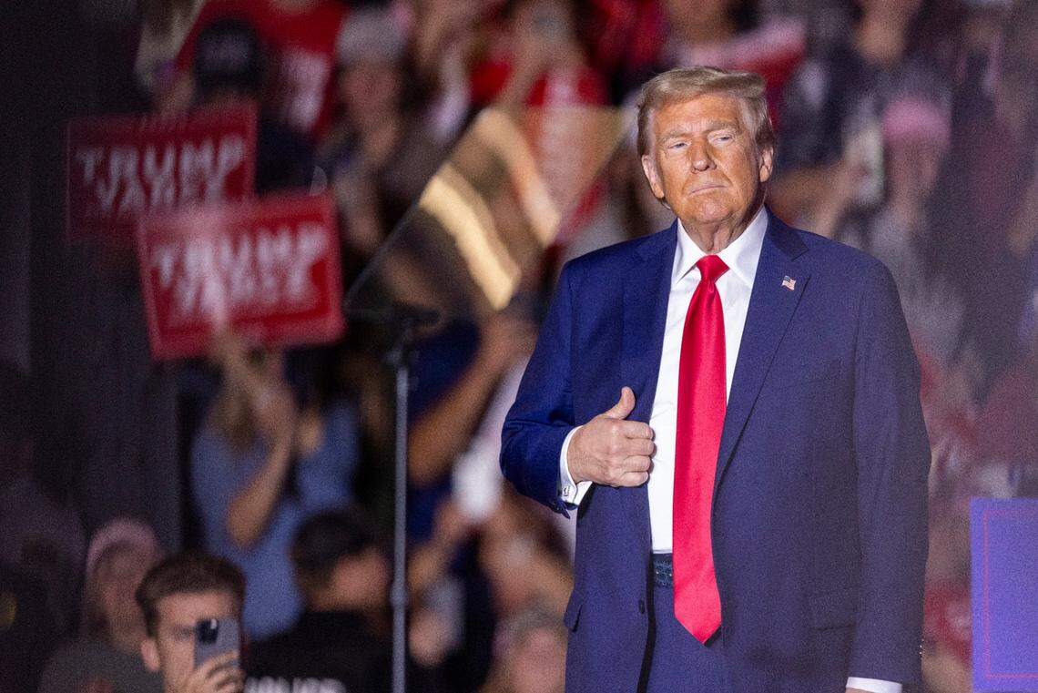 Former President Donald Trump takes the stage during a rally at Minges Coliseum in Greenville on Monday, Oct. 21, 2024. With two weeks until Election Day, Trump went on a three-city tour, in which Trump will also see the destruction caused by Hurricane Helene in Asheville and speak at a faith conference in Concord.