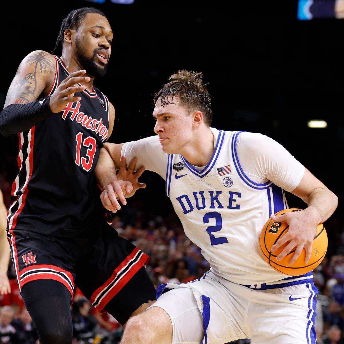 Duke’s Cooper Flagg drives against Houston’s J’Wan Roberts in second half action in the Final Four.