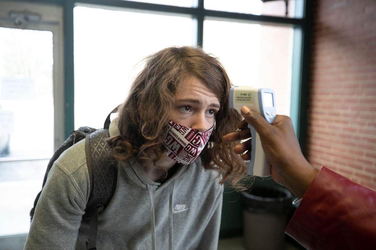 Rocky Carter has his temperature taken before being allowed into the John Graham Gym for Warren County High School’s basketball game against Bunn on Tuesday, February, 2, 2021 in Warrenton, N.C.