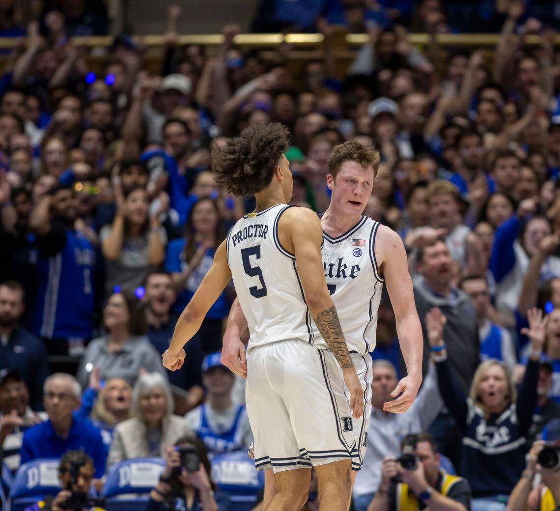 Duke guard Kon Knueppel (7) reacts with teammate Tyrese Proctor (5) after a basket to give the Blue Devils a commanding 59-34 lead over North Carolina in the second half on Saturday, February 1, 2025 at Cameron Indoor Stadium in Durham, N.C. Knueppel lead all scores with 22 points in the Blue Devils’ 87-70 victory.
