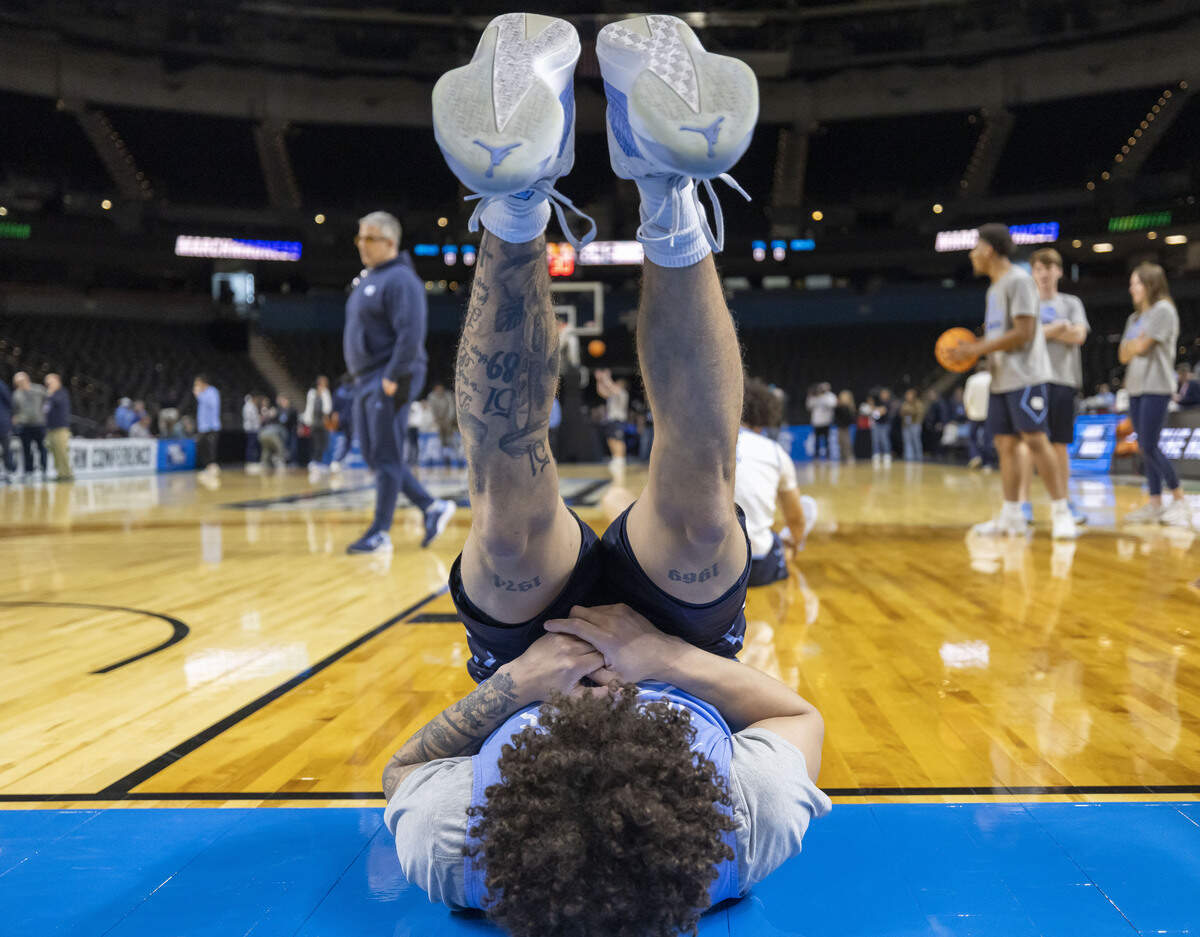 North Carolina guard Kyan Evans (0) stretches during the Tar Heels’ practice on Wednesday, March 18, 2026 in Greenville, S.C.  North Carolina will face VCU in the opening round of the NCAA Tournament.