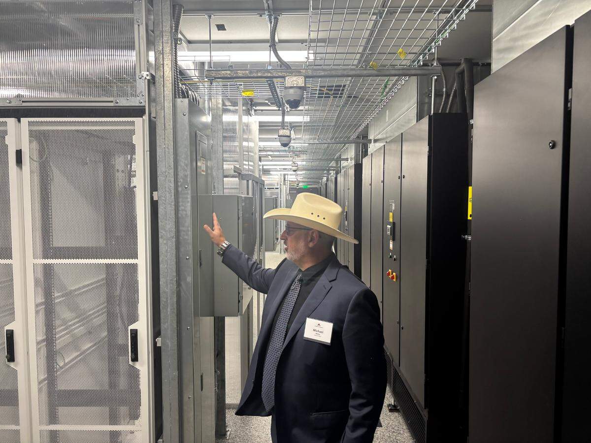 Michael Bailey, a Pittsboro-based systems engineer at American Tower, gives tour of the new edge data center in Raleigh, North Carolina on May 21, 2025.