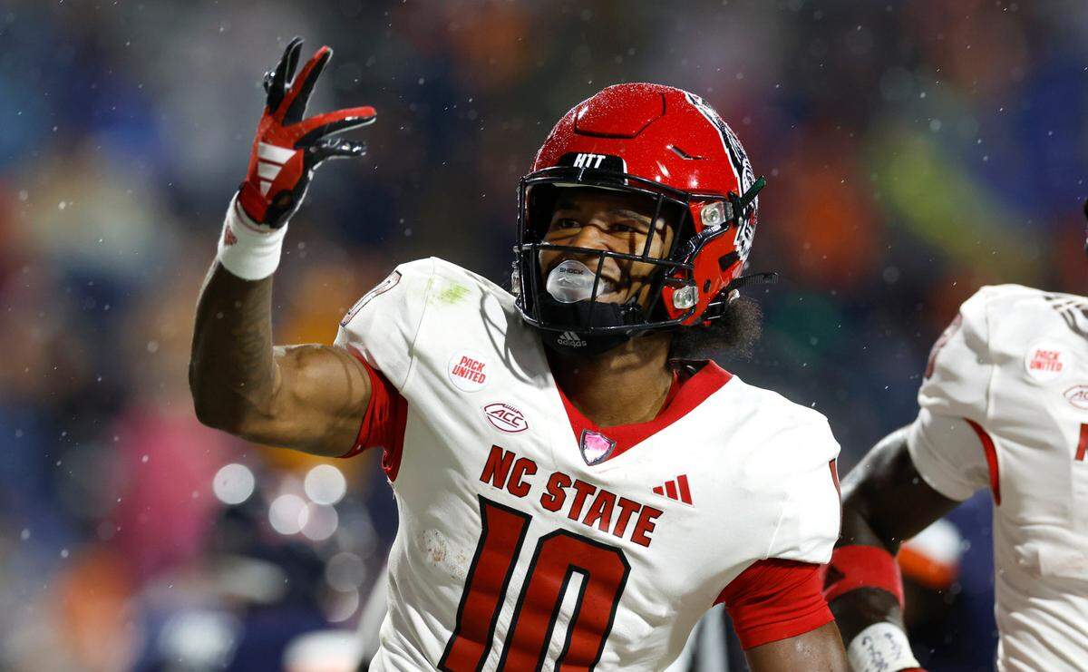 N.C. State wide receiver KC Concepcion (10) celebrates scoring on a 48-yard touchdown reception during the second half of N.C. State’s 24-21 victory over Virginia at Scott Stadium in Charlottesville, Va., Friday, Sept. 22, 2023.