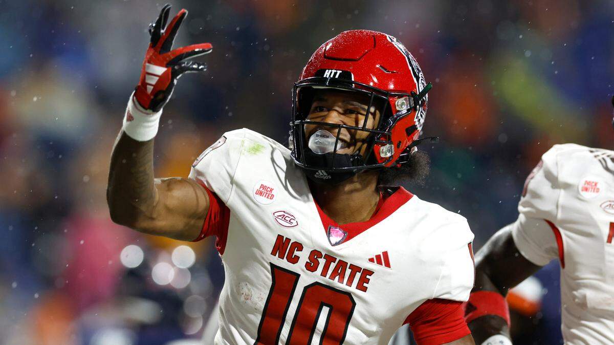 N.C. State wide receiver KC Concepcion (10) celebrates scoring on a 48-yard touchdown reception during the second half of N.C. State’s 24-21 victory over Virginia at Scott Stadium in Charlottesville, Va., Friday, Sept. 22, 2023.