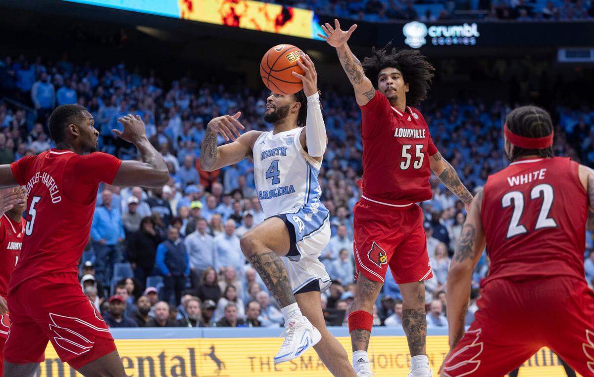 North Carolina’s R.J. Davis (4) breaks to the basket through the Louisville defense in the second half on Wednesday, January 17, 2024 at the Smith Center in. Chapel Hill, N.C.