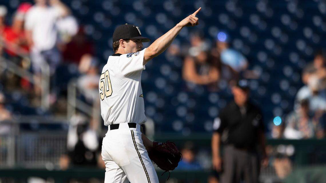 Vanderbilt closing pitcher Luke Murphy (50) signals right fielder Troy LaNeve after he snagged the second out in the bottom of the ninth inning against North Carolina State during a baseball game in the College World Series, Friday, June 25, 2021, at TD Ameritrade Park in Omaha.