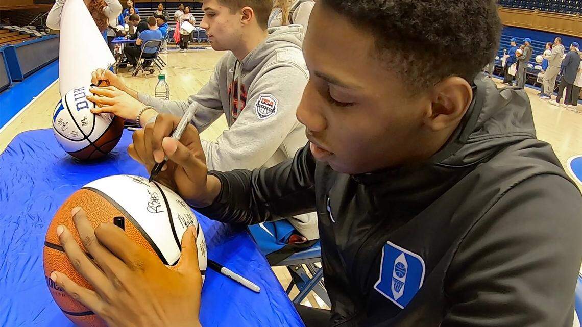 Duke’s RJ Barrett (right) and teammate Joey Baker (left) autograph basketballs during a fan appreciation session at Cameron Indoor Stadium In Durham, N.C. Saturday, Dec. 29, 2018. Almost 2000 fans lined up for hours to get various items autographed by the team.
