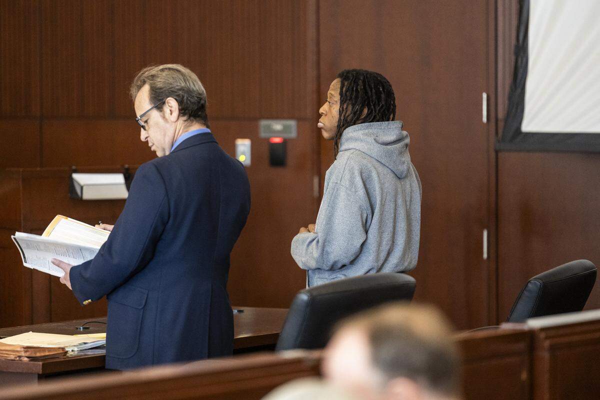 Tyrell Moore, right, stands with attorney Seth Blum during a sentencing hearing on Monday, June 1, 2026, at the Wake County Justice Center in Raleigh. Moore pleaded guilty earlier this year to voluntary manslaughter in the death of David Millette Jr., who died after Moore struck him during a confrontation in Raleigh's Glenwood South district in August 2023.
