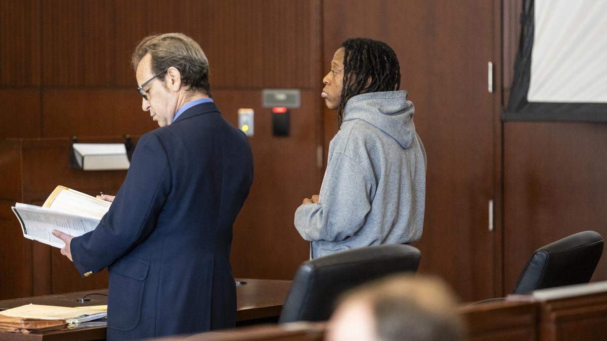 Tyrell Moore, right, stands with attorney Seth Blum during a sentencing hearing on Monday, June 1, 2026, at the Wake County Justice Center in Raleigh. Moore pleaded guilty earlier this year to voluntary manslaughter in the death of David Millette Jr., who died after Moore struck him during a confrontation in Raleigh's Glenwood South district in August 2023.