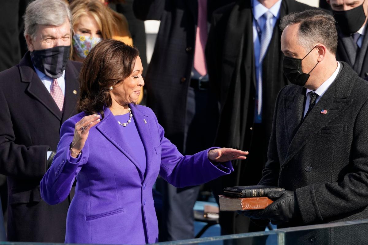 Kamala Harris is sworn in as vice president by Supreme Court Justice Sonia Sotomayor as her husband Doug Emhoff holds the Bible during the 59th Presidential Inauguration at the U.S. Capitol in Washington, Wednesday, Jan. 20, 2021.