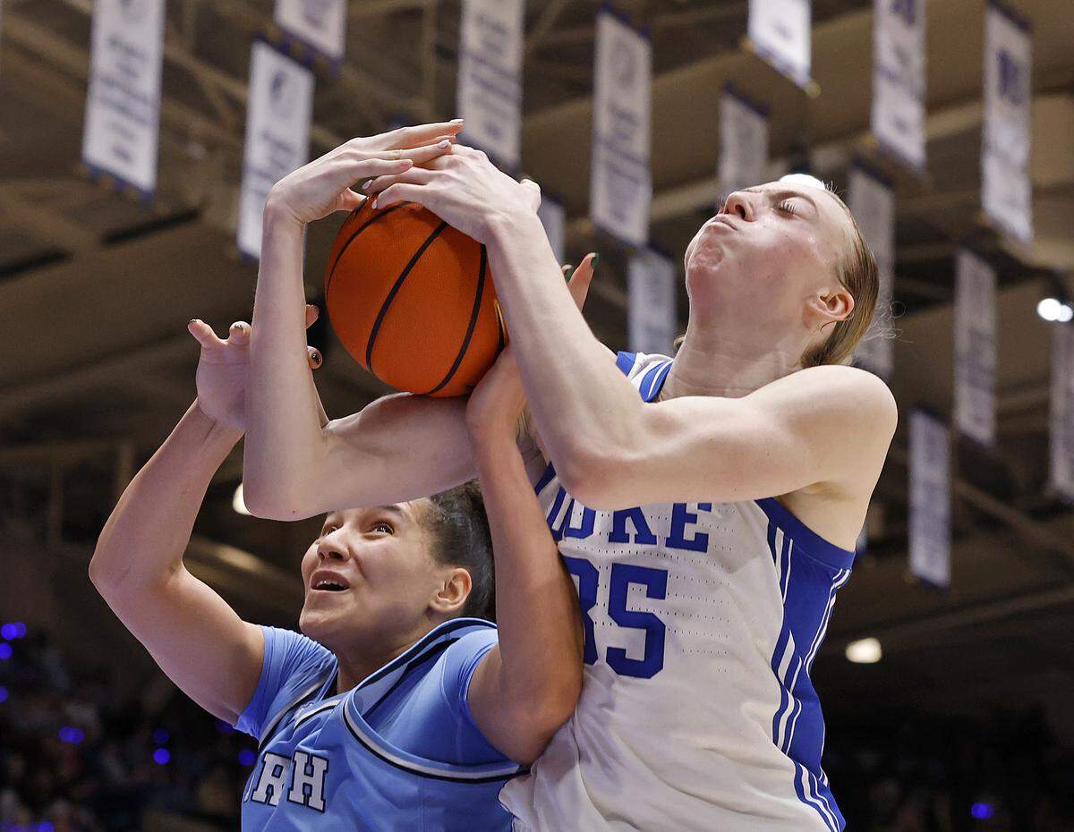 North Carolina’s Taissa Queiroz and Duke’s Toby Fournier battle for a rebound during the second half of the Tar Heels’ 72-68 loss on Sunday, Feb. 15, 2026, at Cameron Indoor Stadium in Durham, N.C.