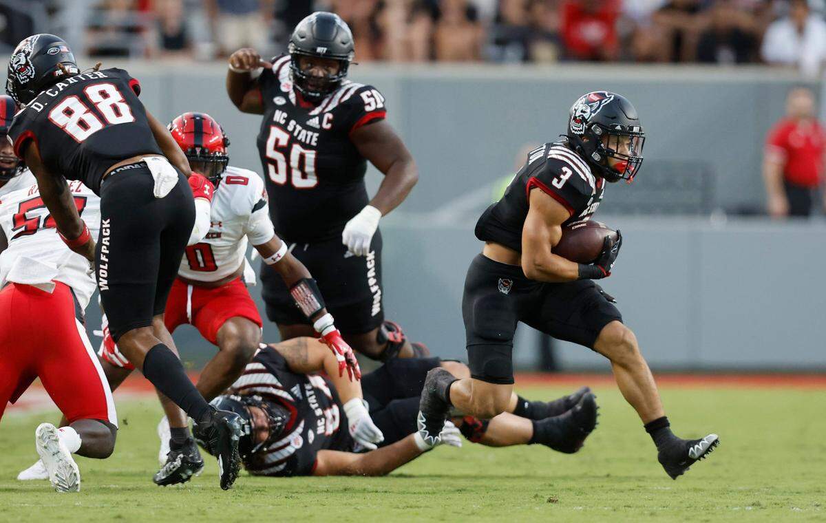 N.C. State running back Jordan Houston (3) gains yards during the first half of N.C. States game against Texas Tech at Carter-Finley Stadium in Raleigh, N.C., Saturday, Sept. 17, 2022.