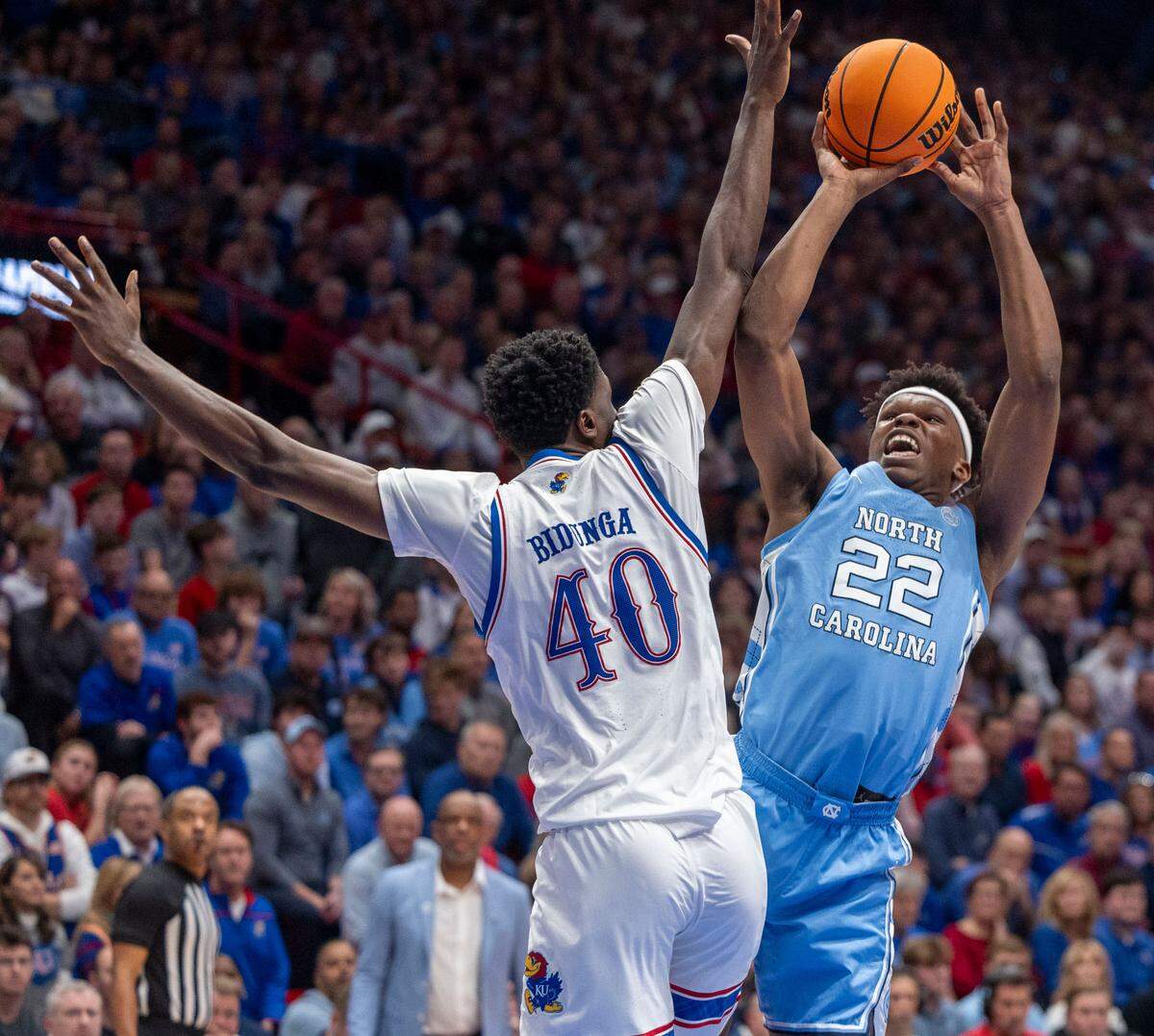 North Carolina forward Ven-Allen Lubin (22) puts up a shot against Kansas guard Justin Cross (25) in the second half on Friday, November 8, 2024 at Allen Fieldhouse in Lawrence, Kansas.