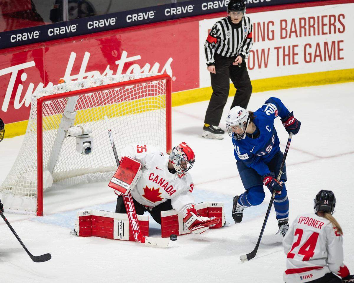 Canada’s Ann-Renee Desbiens makes a save after a redirected shot from USA’s Hilary Knight at the Adirondack Bank Center on Monday, April 8, 2024.