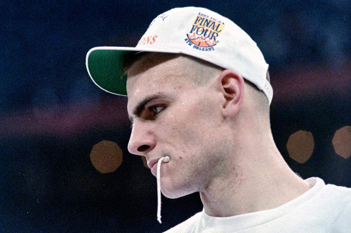 UNC center Eric Montross bites on a piece of the victory nets during postgame ceremonies after the Tar Heels defeated Michigan to win the 1993 NCAA Championship in New Orleans.
