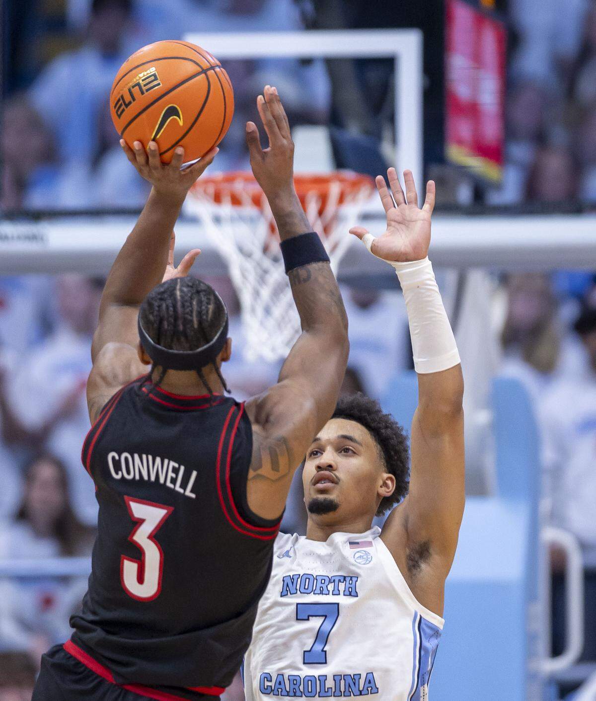 North Carolina guard Seth Trimble (7) defends Louisville guard Ryan Conwell (3) in the first half on Monday, February 23, 2026 at the Smith Center in Chapel Hill, N.C.