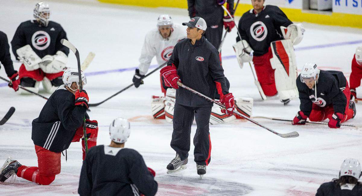 Carolina Hurricanes coach Rod Brind’Amour works with his team during the opening day of training camp on Thursday, September 23, 2021 at PNC Arena in Raleigh, N.C.