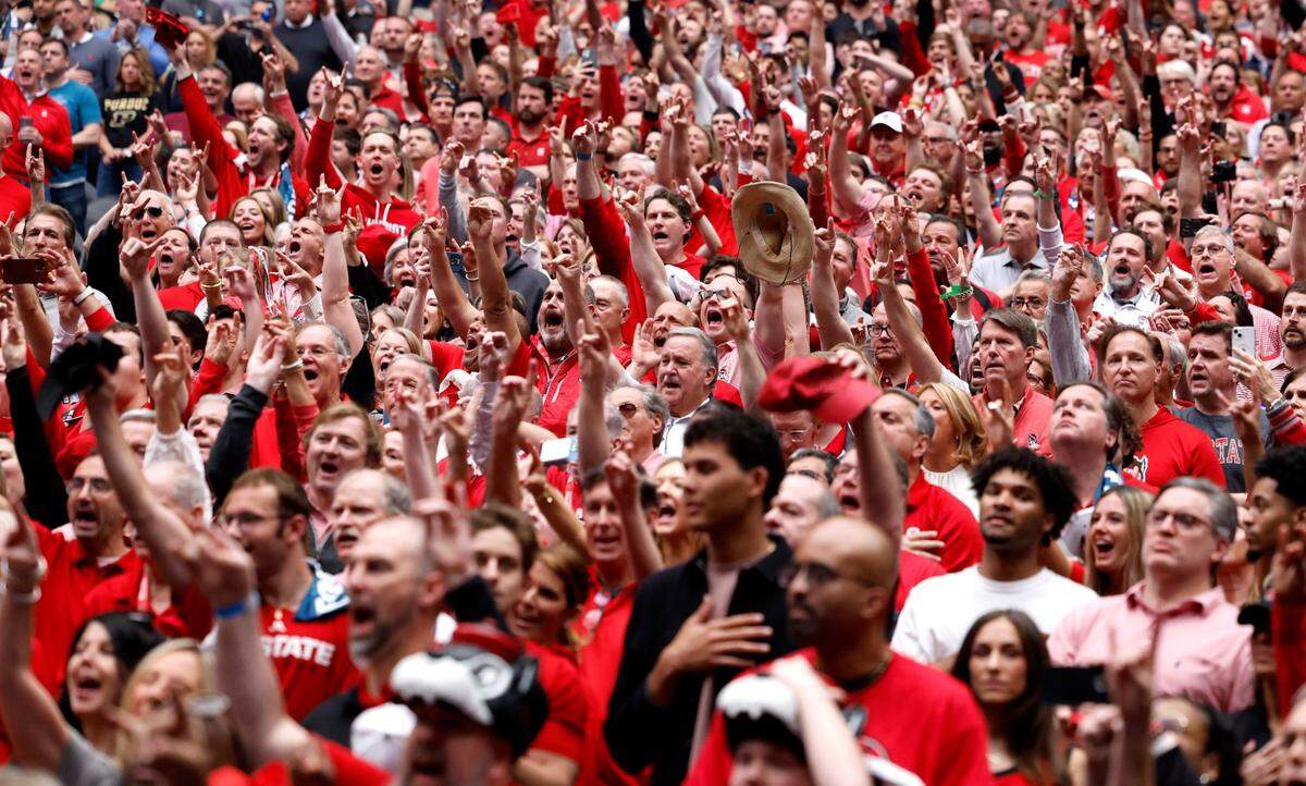 Fans cheer on the Wolfpack before N.C. State’s game against Purdue in the NCAA Tournament national semfinals at State Farm Stadium in Glendale, Ariz., Saturday, April 6, 2024.