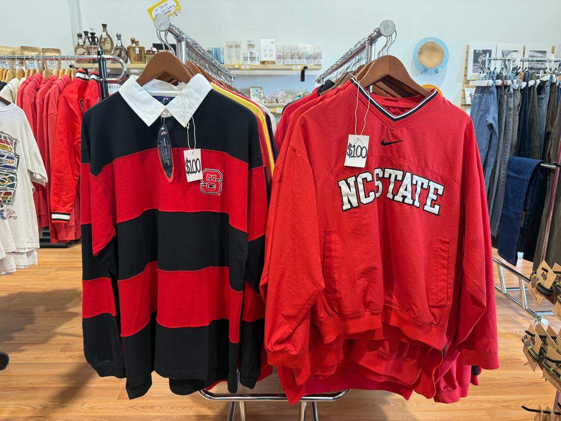 There are racks of N.C. State-branded clothing at The Burrow at 300 W. Hargett St.
