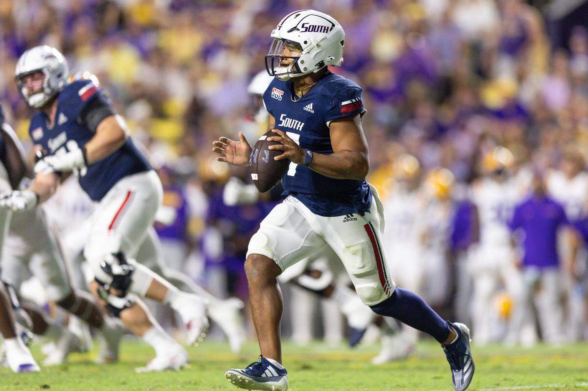 Sep 28, 2024; Baton Rouge, Louisiana, USA; South Alabama Jaguars quarterback Gio Lopez (7) rolls out against the LSU Tigers during the second quarter at Tiger Stadium. Mandatory Credit: Stephen Lew-Imagn Images