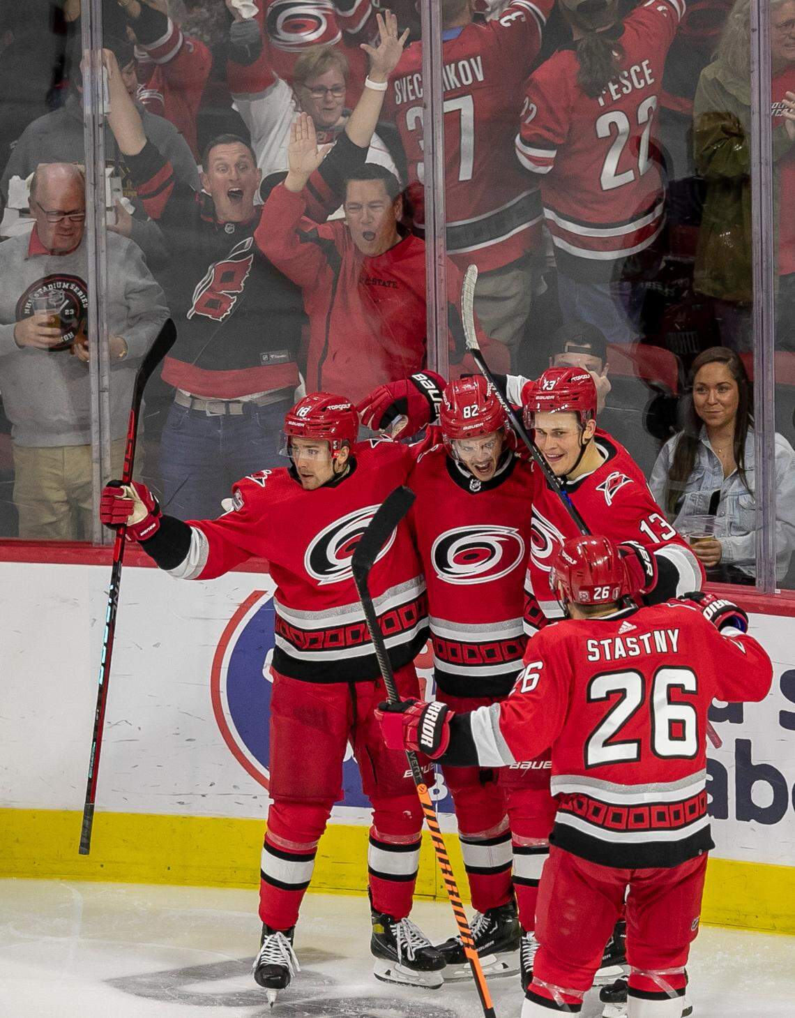 The Carolina Hurricanes Jack Drury (18), Jesse Piljujarvi (13) and Paul Stastny (26) congratulate Jesperi Kotkaniemi (82) after he scored the first of two goals against the New Jersey Devils goalie Akira Schmid (40) in the second period during Game 2 of their second round Stanley Cup playoff series on Friday, May 5, 2023 at PNC Arena in Raleigh, N.C.