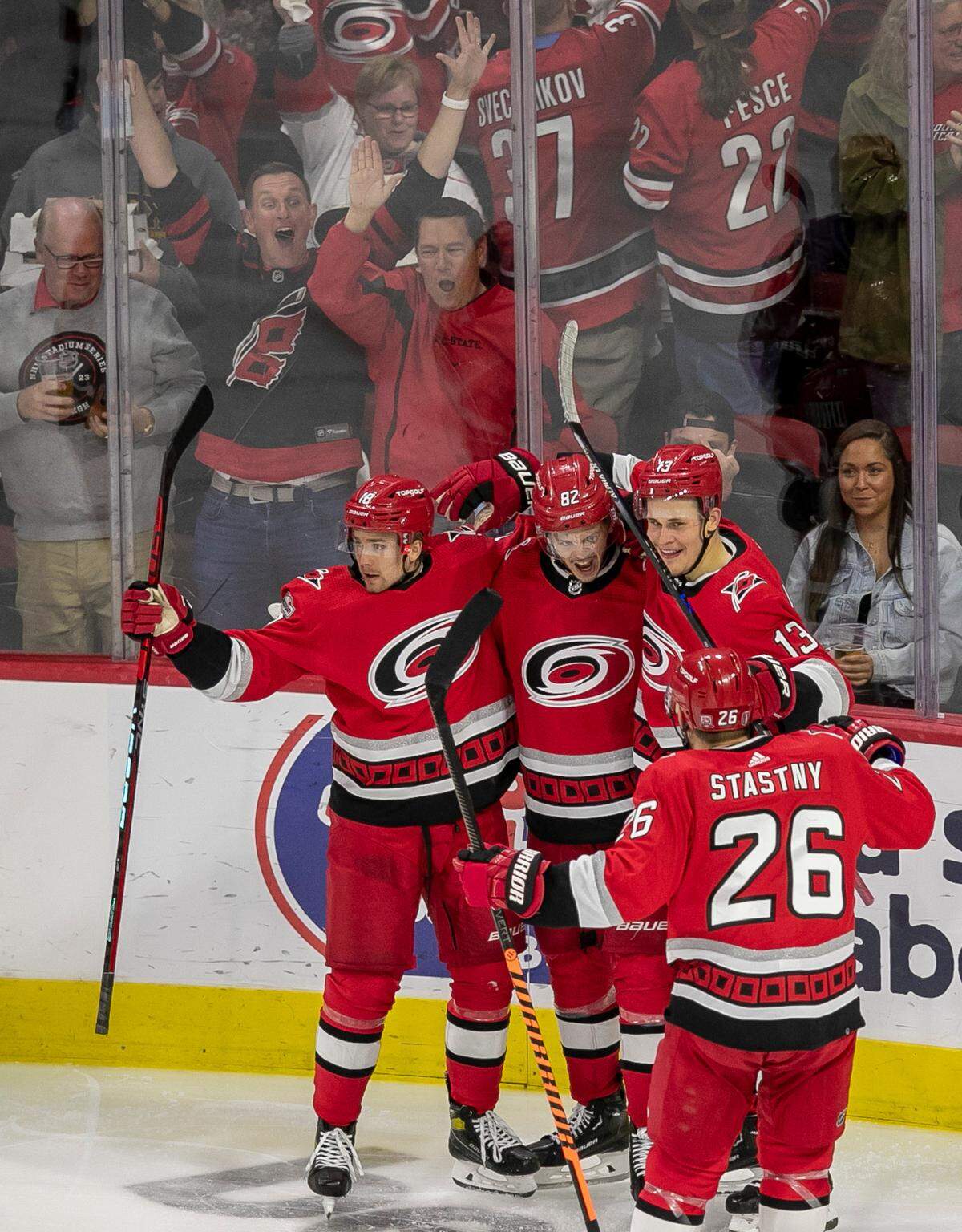 The Carolina Hurricanes Jack Drury (18), Jesse Piljujarvi (13) and Paul Stastny (26) congratulate Jesperi Kotkaniemi (82) after he scored the first of two goals against the New Jersey Devils goalie Akira Schmid (40) in the second period during Game 2 of their second round Stanley Cup playoff series on Friday, May 5, 2023 at PNC Arena in Raleigh, N.C.
