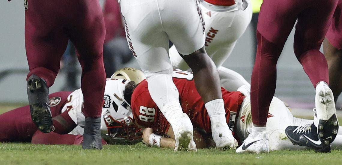 N.C. State punter Caden Noonkester (98) dives on the loose ball after his punt hit a Florida State player during the second half of N.C. State’s 21-11 victory over Florida State at Carter-Finley Stadium in Raleigh, N.C., Friday, Nov. 21, 2025.