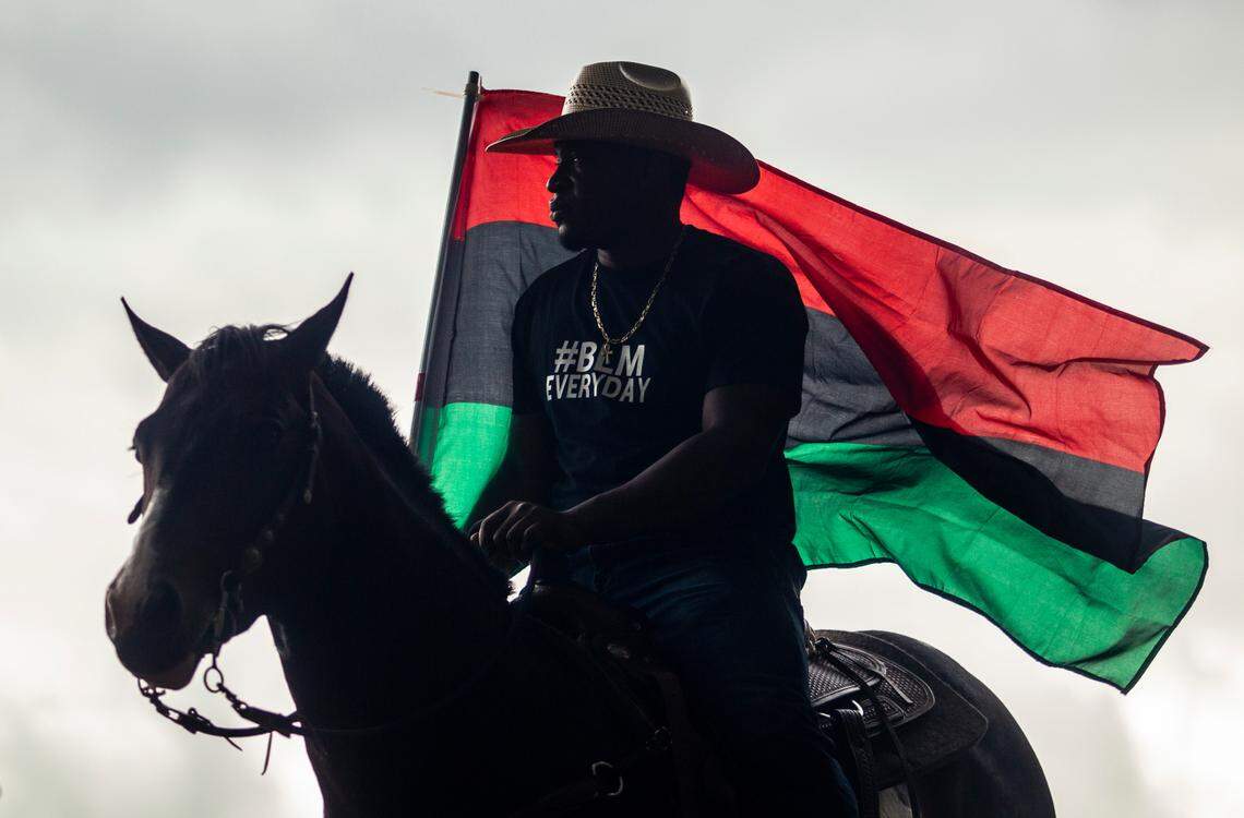 Marcel Collymore and his horse ÒBrewÓ prepare to take part in a Black Lives Matter demonstration ride through downtown Raleigh Friday, June 19, 2020 in recognition of Juneteenth.