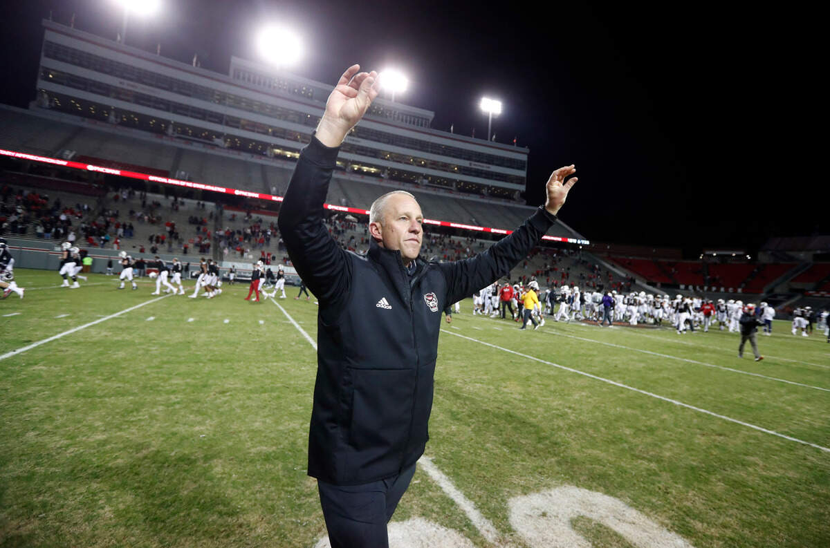N.C. State head coach Dave Doeren acknowledges the students after N.C. State’s 23-13 victory over Georgia Tech at Carter-Finley Stadium in Raleigh, N.C., Saturday, Dec. 5, 2020.