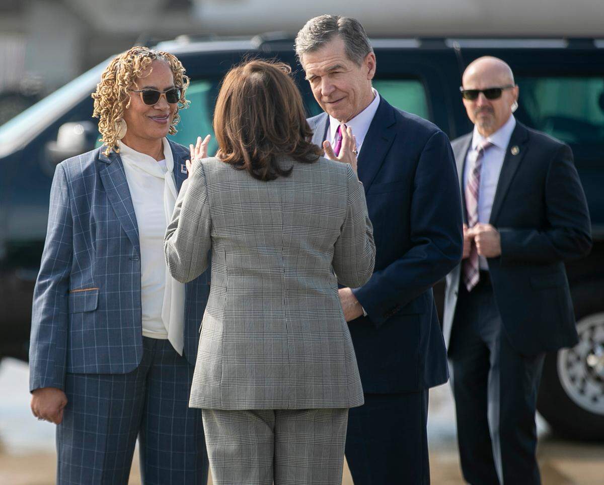 Vice President Kamala Harris talks with North Carolina Governor Roy Cooper and Durham Mayor Elaine O’Neal upon her arrival on Monday, January 30, 2023 at RDU International Airport in Morrisville, N.C.