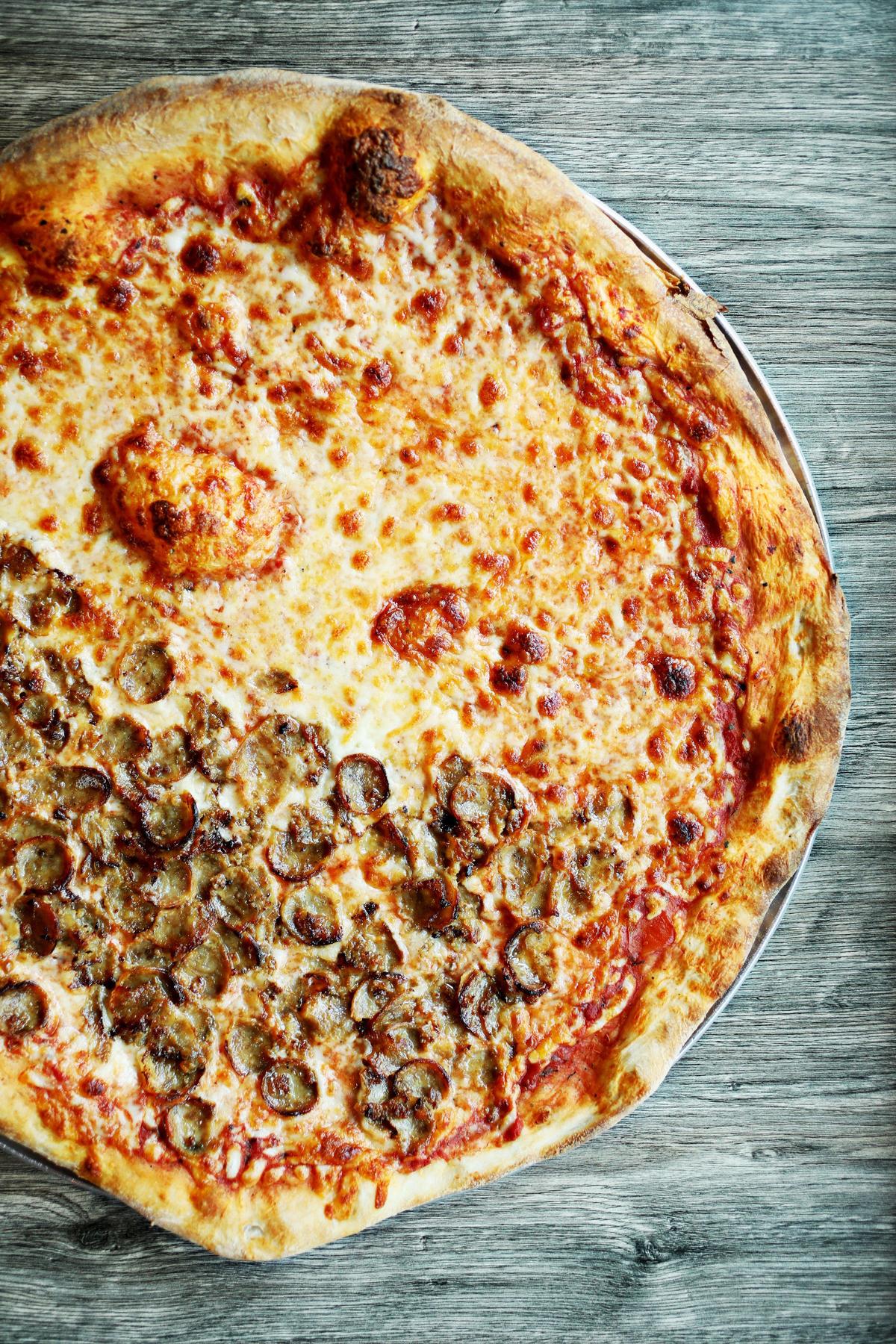J & S New York Pizza in Cary has pizza, whose thin, beautifully browned crusts is crisp from edge to edge, and generously topped with your choice of pretty much any topping combination you can think of.